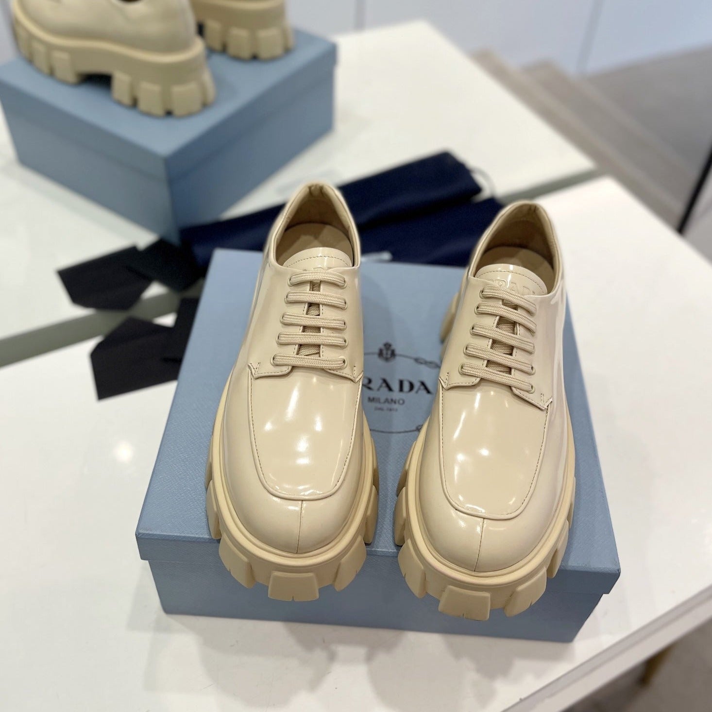 PRADA BRUSHED LEATHER MONOLITH LACE-UP LOAFERS BEIGE