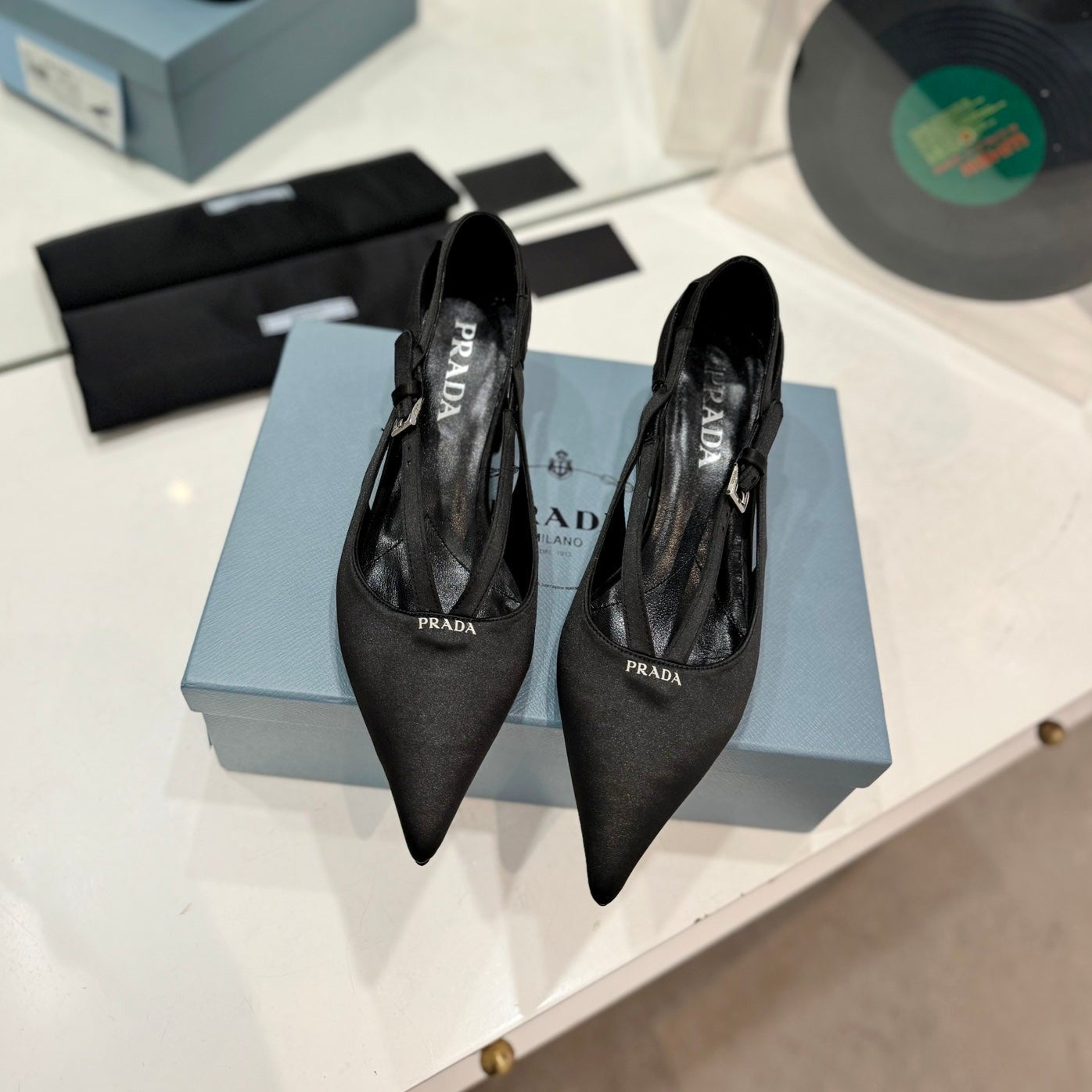 PRADA STRAP CUT-OUT PUMPS BLACK SATIN