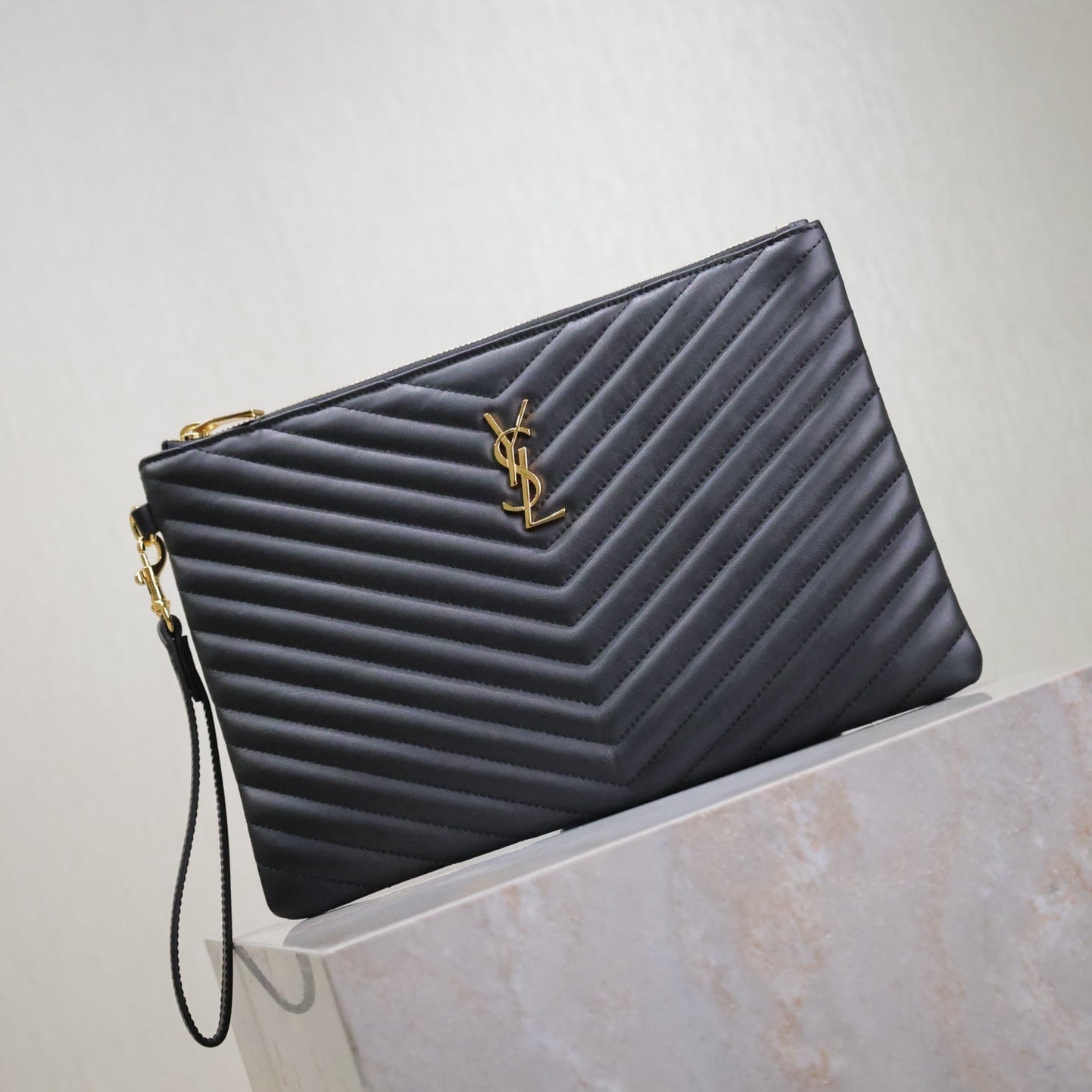 Saint Laurent CLUTCH 30 IN BLACK QUILTED CALFSKIN GOLD BUCKLE