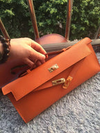 Hermes Orange Handcrafted Kelly Cut Clutch