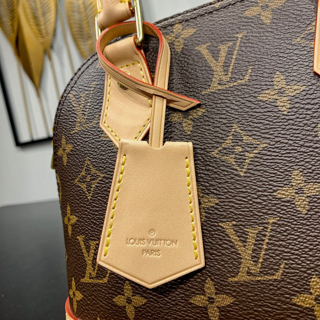 Louis Vuitton ALMA BB 23 IN BROWN MONOGRAM CANVAS AND BEIGE CALFSKIN TRIM GOLD BUCKLE