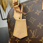Louis Vuitton ALMA BB 23 IN BROWN MONOGRAM CANVAS AND BEIGE CALFSKIN TRIM GOLD BUCKLE