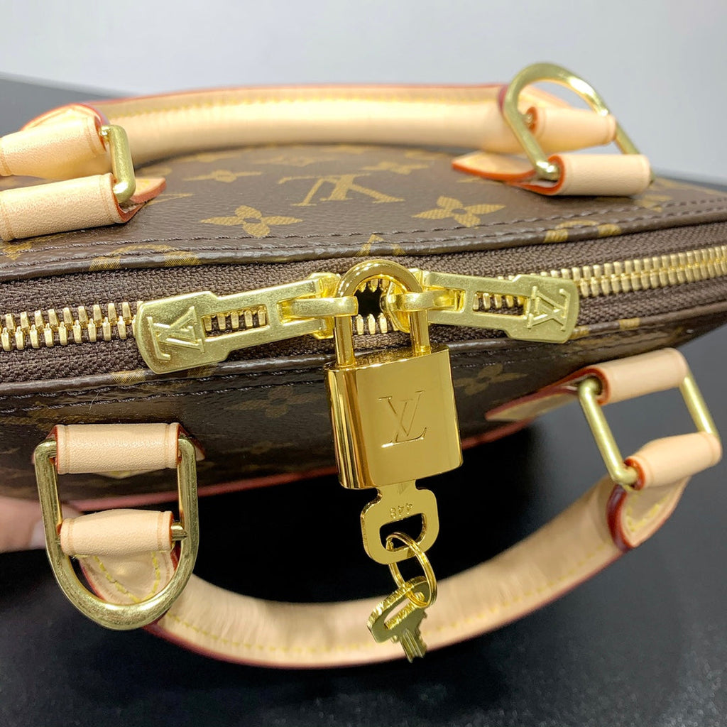 Louis Vuitton ALMA BB 23 IN BROWN MONOGRAM CANVAS AND BEIGE CALFSKIN TRIM GOLD BUCKLE