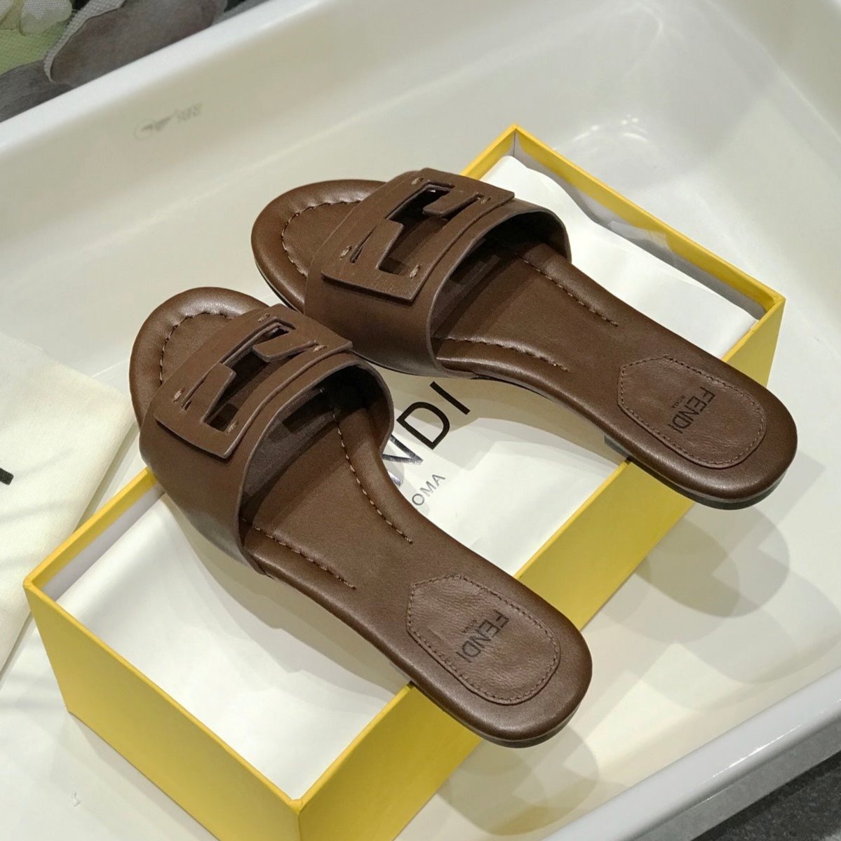 FENDI FENDI BAGUETTE SLIDES IN COFFEE BROWN LAMBSKIN