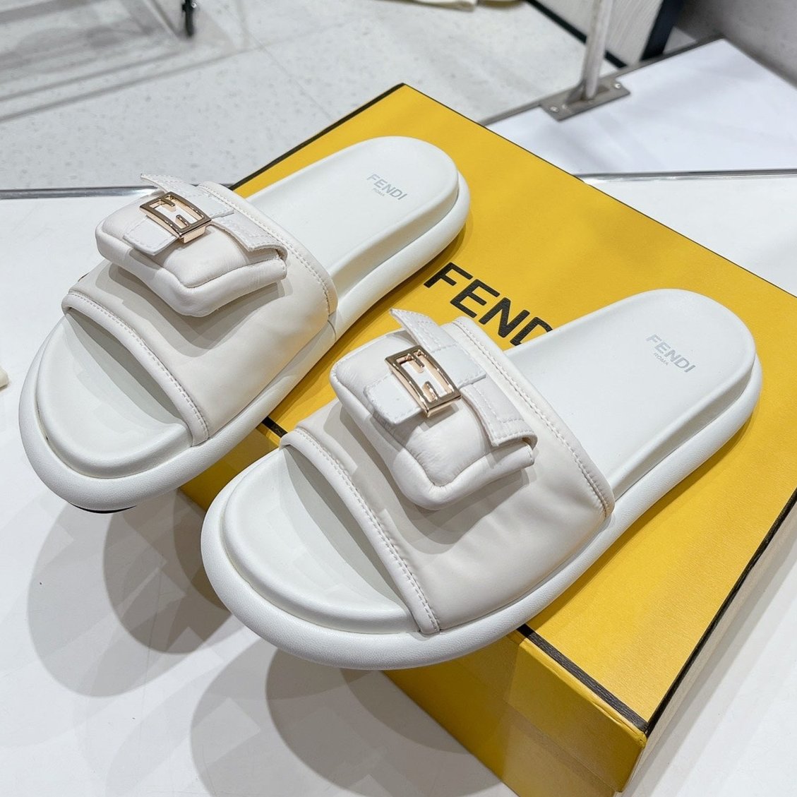 FENDI FENDI BAGUETTE SLIPPERS IN WHITE LAMBSKIN WITH GOLD HARDWARE