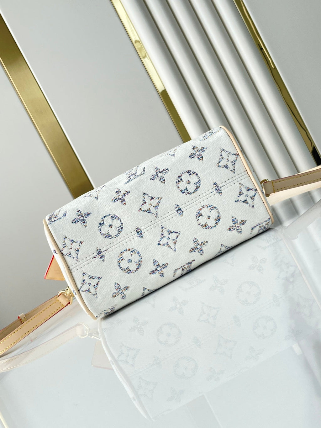 Louis Vuitton SPEEDY BANDOULIÈRE 20 IN WHITE MONOGRAM JACQUARD FABRIC AND BEIGE CALFSKIN TRIM