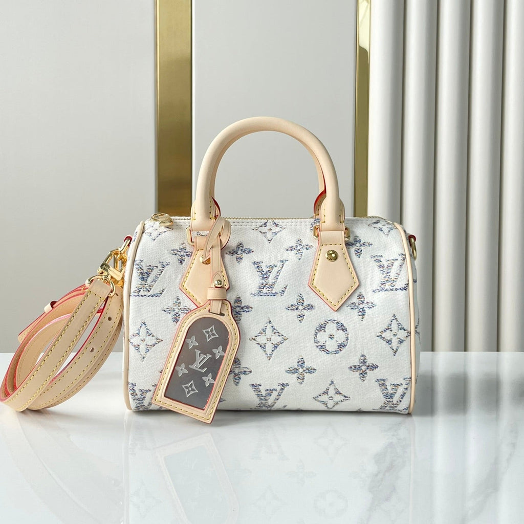 Louis Vuitton SPEEDY BANDOULIÈRE 20 IN WHITE MONOGRAM JACQUARD FABRIC AND BEIGE CALFSKIN TRIM