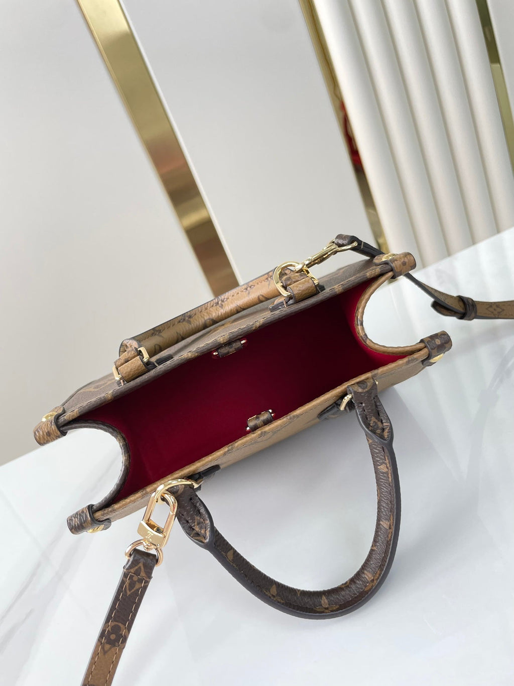 Louis Vuitton ONTHEGO BB 18 IN BROWN MONOGRAM AND MONOGRAM REVERSE CANVAS