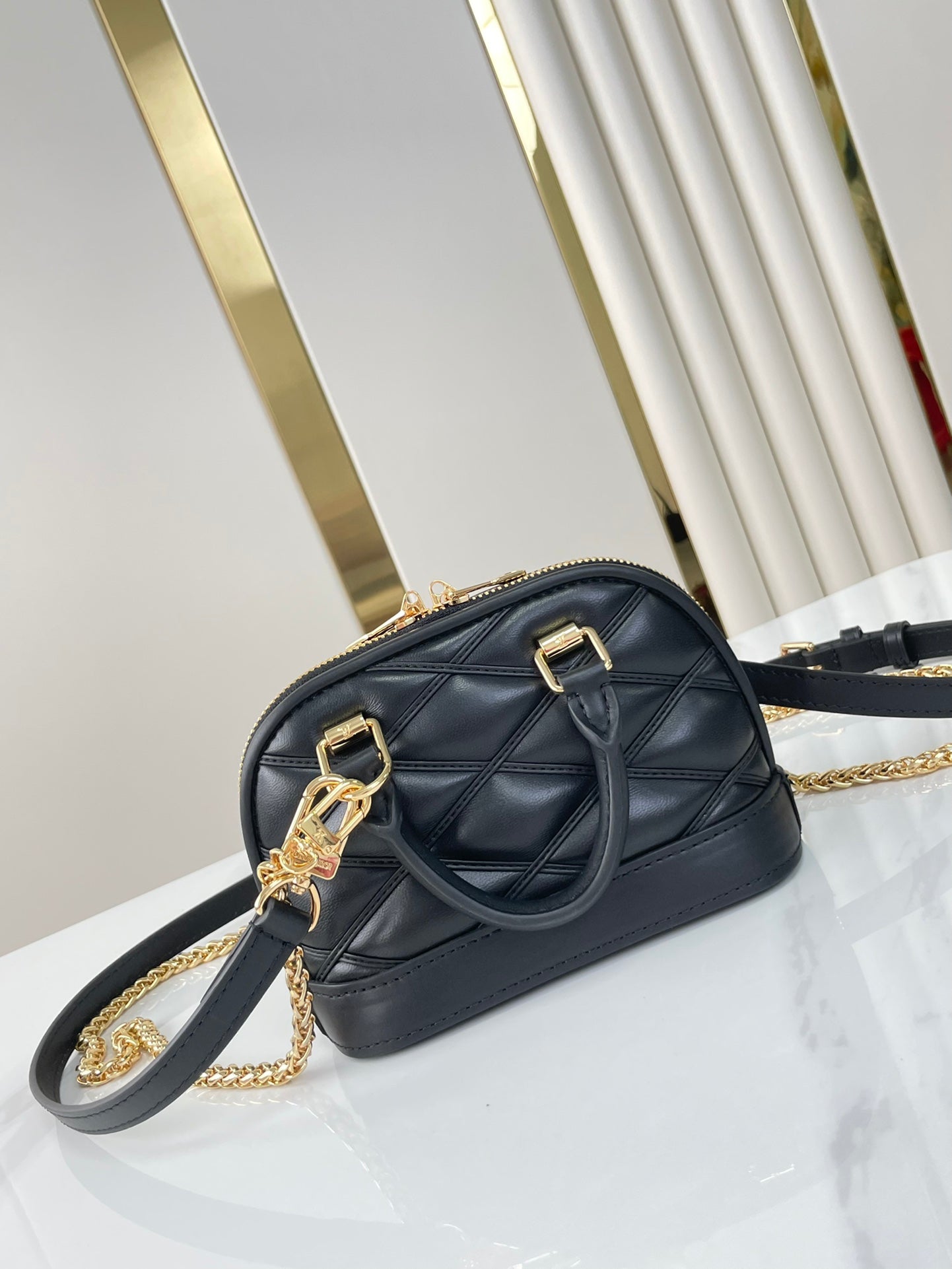 Louis Vuitton NANO ALMA 18 IN BLACK QUILTED LAMBSKIN GOLD HARDWARE