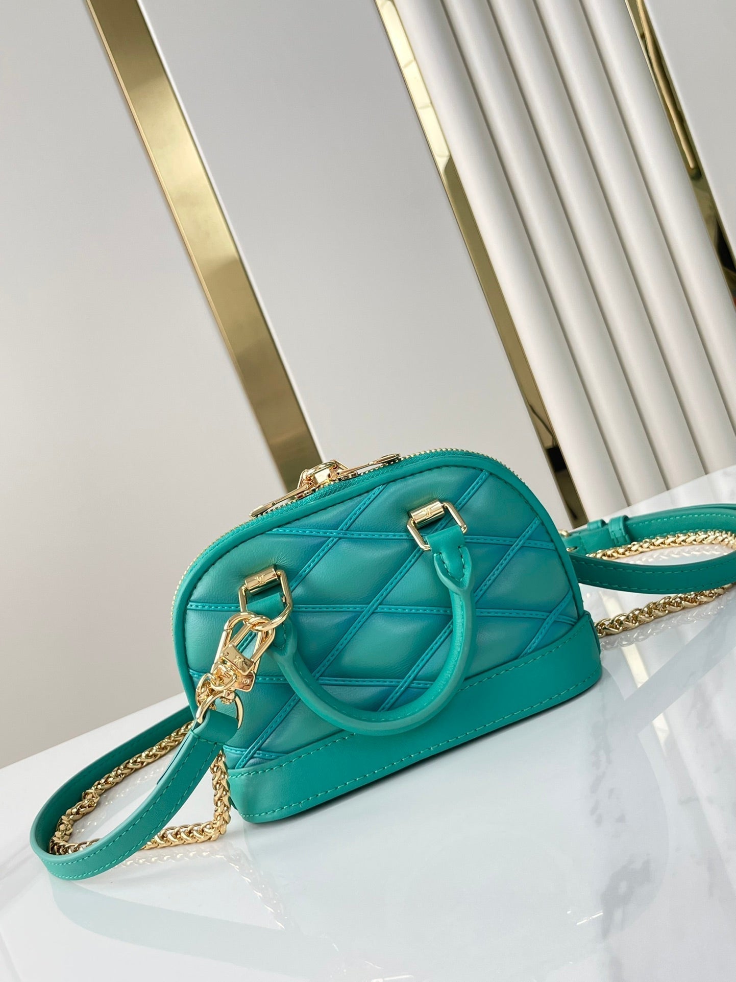 Louis Vuitton NANO ALMA 18 IN TURQUOISE QUILTED LAMBSKIN GOLD HARDWARE