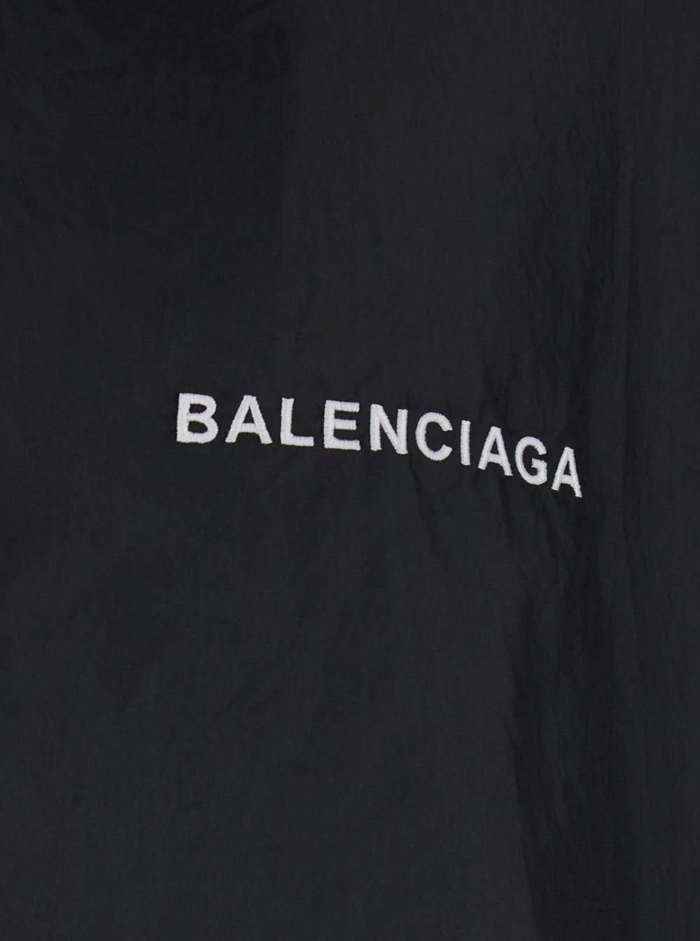 Balenciaga Men Black Jacket With Logo Lettering On The Front And Logo Patch On The Elbow In Tech Fabric Man