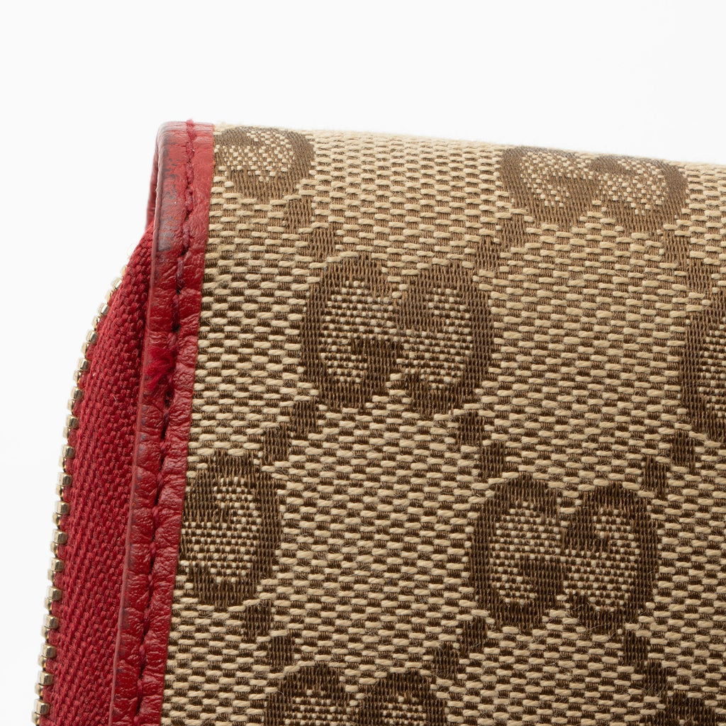 Gucci GG Canvas Zip Around Wallet (SHF-pjF8AV)
