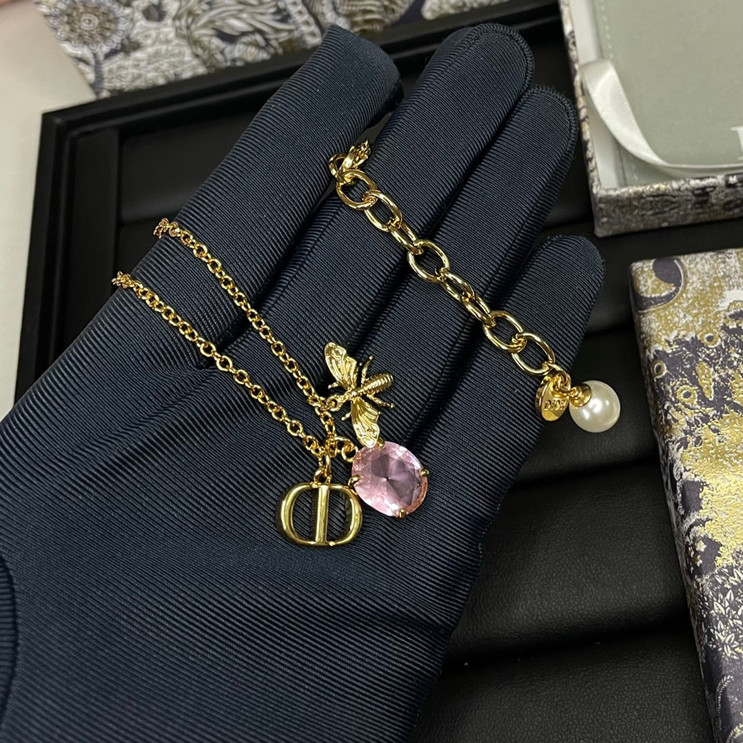 DIOR GOLD-COLORED METAL WITH WHITE RESIN PEARL NECKLACE