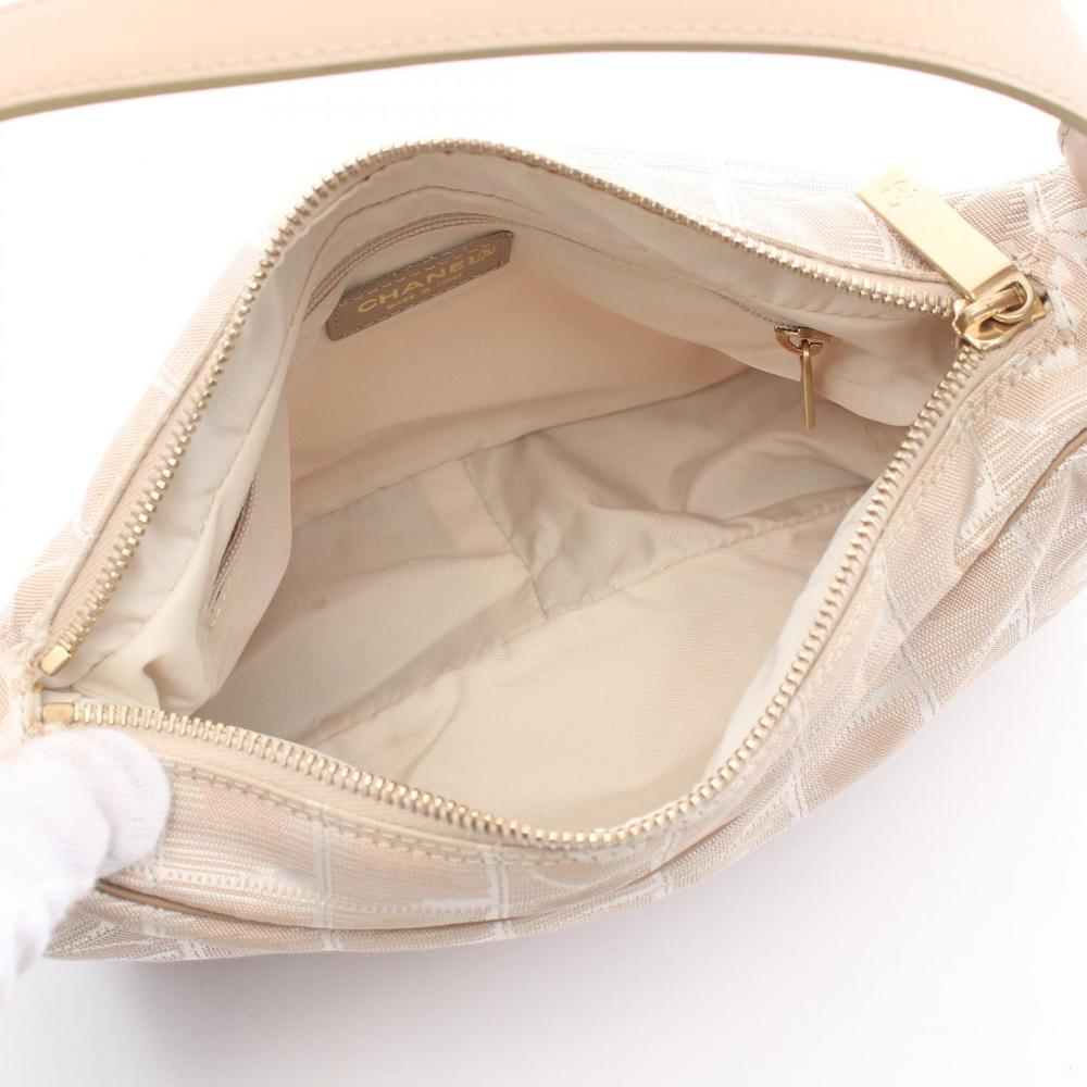 Beige Leather Chanel Travel Line