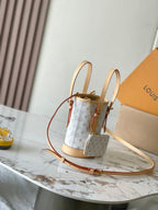 Louis Vuitton NANO BUCKET 17 IN WHITE MONOGRAM JACQUARD AND BEIGE CALFSKIN TRIM