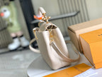 Louis Vuitton CAPUCINES MINI 21 BEIGE TAURILLON GOLD HARDWARE