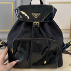 BACKPACK 30 IN BLACK RE-NYLON AND PATENT CALFSKIN GOLD HARDWARE
