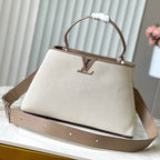 Louis Vuitton CAPUCINES SOUPLE GM 38 IN WHITE CANVAS AND TAUPE CALFSKIN TRIM