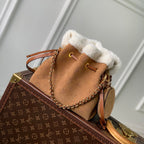 Louis Vuitton BELLA 22 IN CINNAMON BROWN MONOGRAM PERFORATED SUEDE AND WHITE SHEARLING TRIM