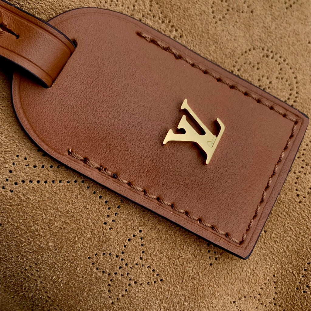 Louis Vuitton CARRYALL PM 29 IN CIDER BROWN MONOGRAM PERFORATED SUEDE AND WHITE SHEARLING TRIM