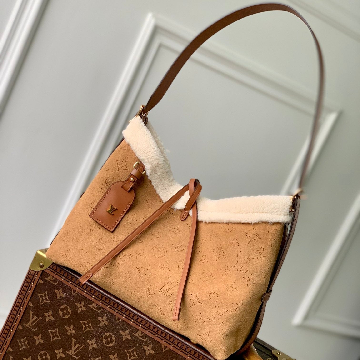 Louis Vuitton CARRYALL PM 29 IN CIDER BROWN MONOGRAM PERFORATED SUEDE AND WHITE SHEARLING TRIM