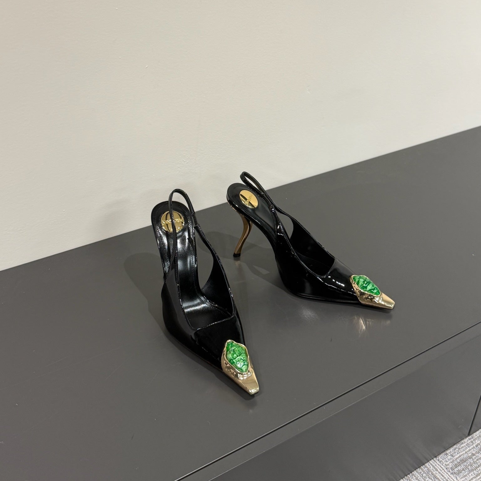 Saint Laurent GREEN GEM-STUDDED SLINGBACK PUMPS IN BLACK PATENT CALFSKIN