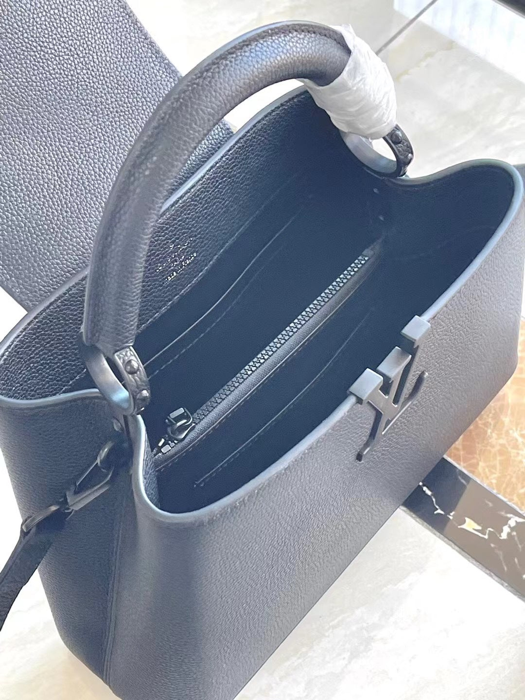 Louis Vuitton CAPUCINES EAST-WEST 27 IN BLACK TAURILLON