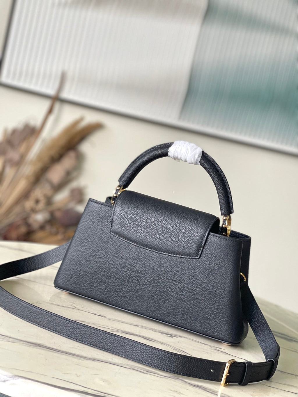 Louis Vuitton CAPUCINES EAST-WEST 33 IN BLACK CALFSKIN GOLD HARDWARE
