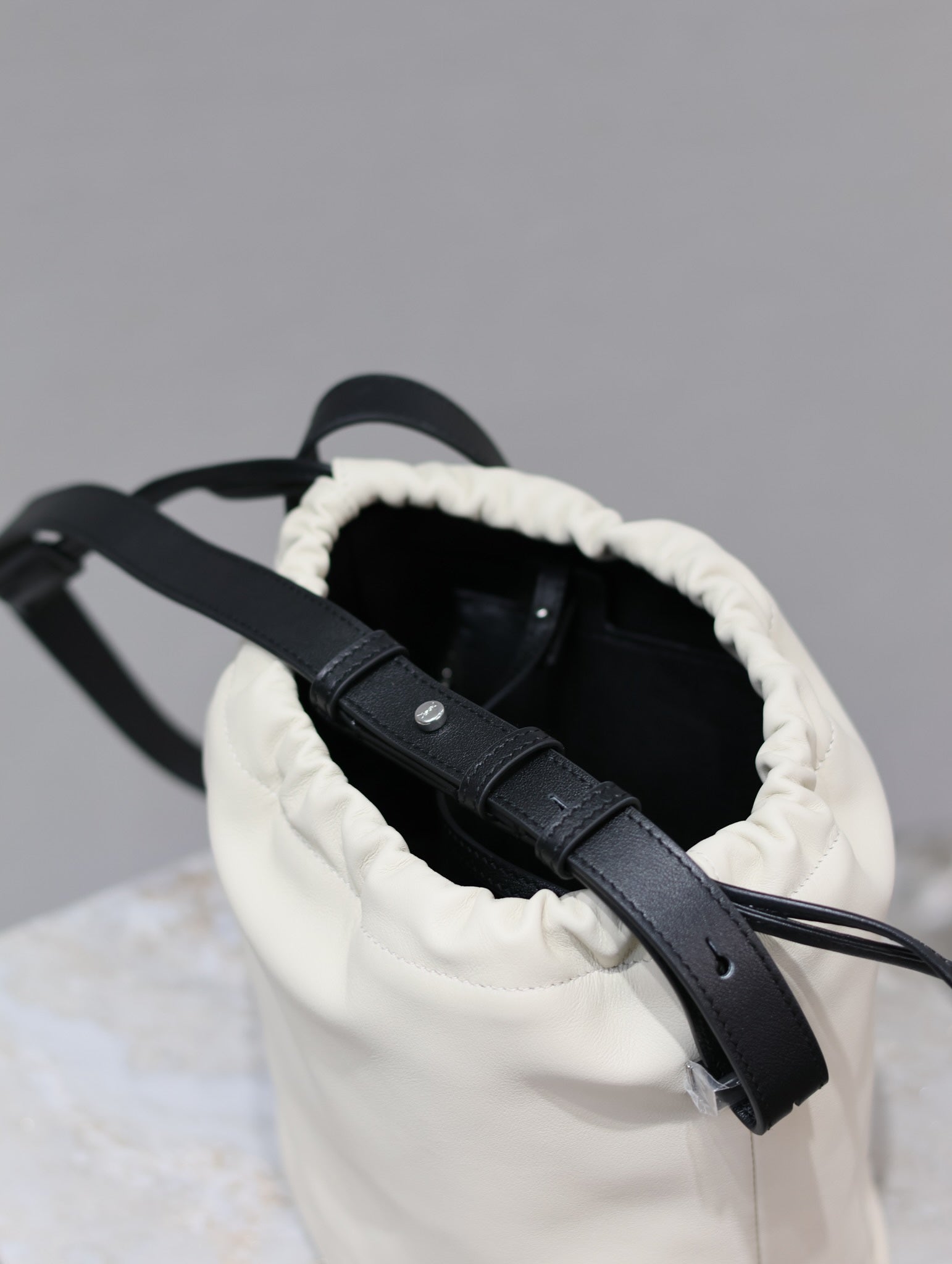 Saint Laurent RIVE GAUCHE BUCKET BAG 23 IN WHITE CALFSKIN