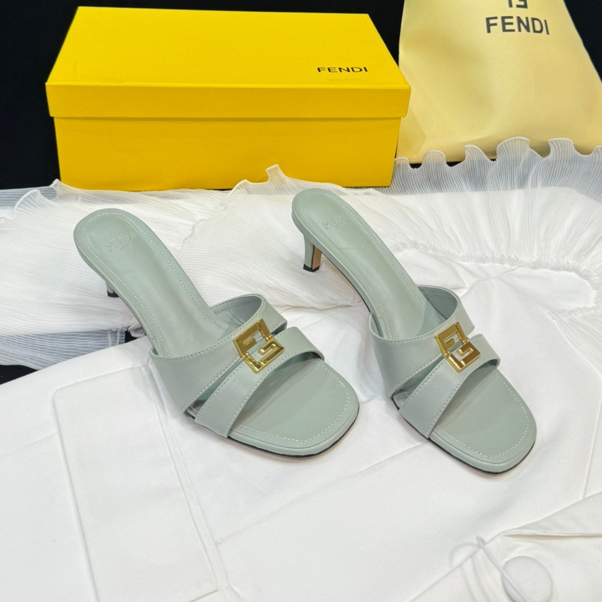 FENDI FENDI MEDIUM-HEELED 55 MM MULE IN ASH GREY LAMBSKIN WITH GOLD HARDWARE