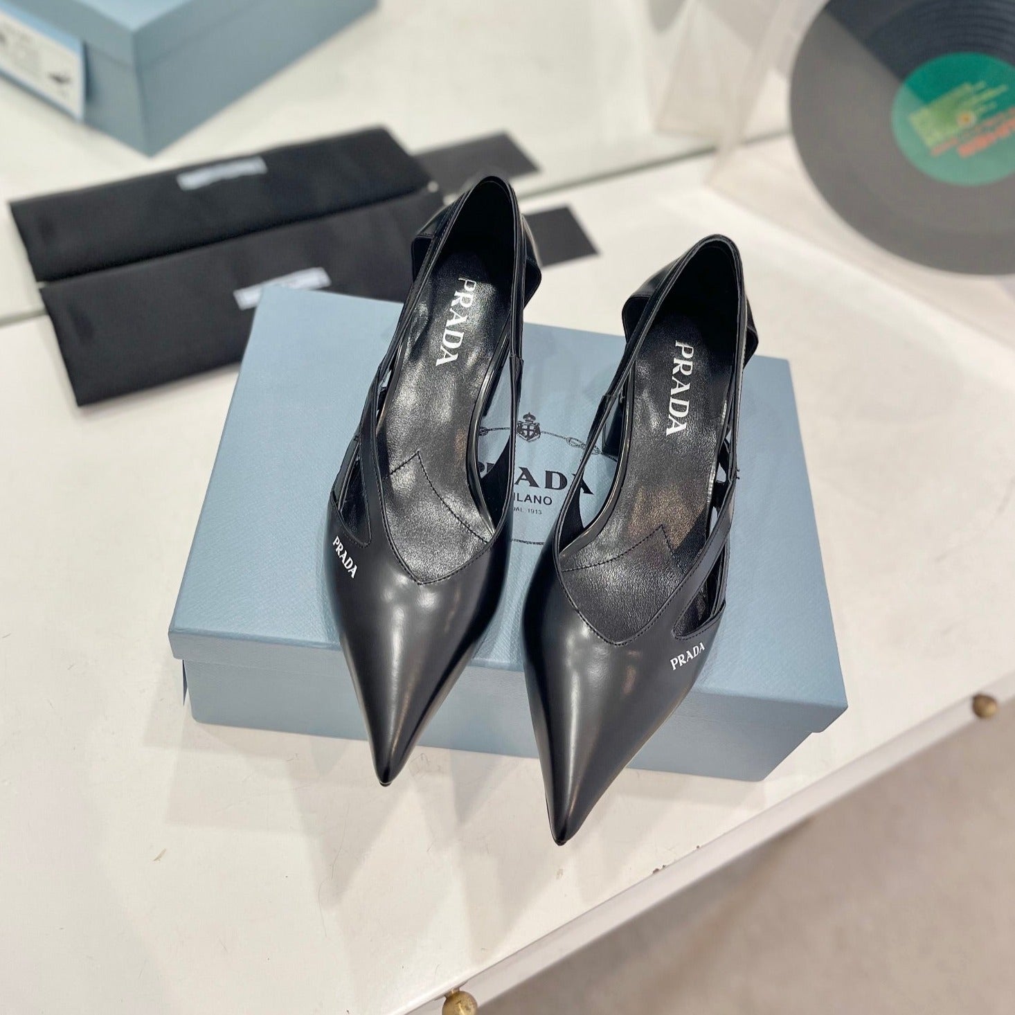 PRADA STRAP CUT-OUT PUMPS BLACK CALFSKIN