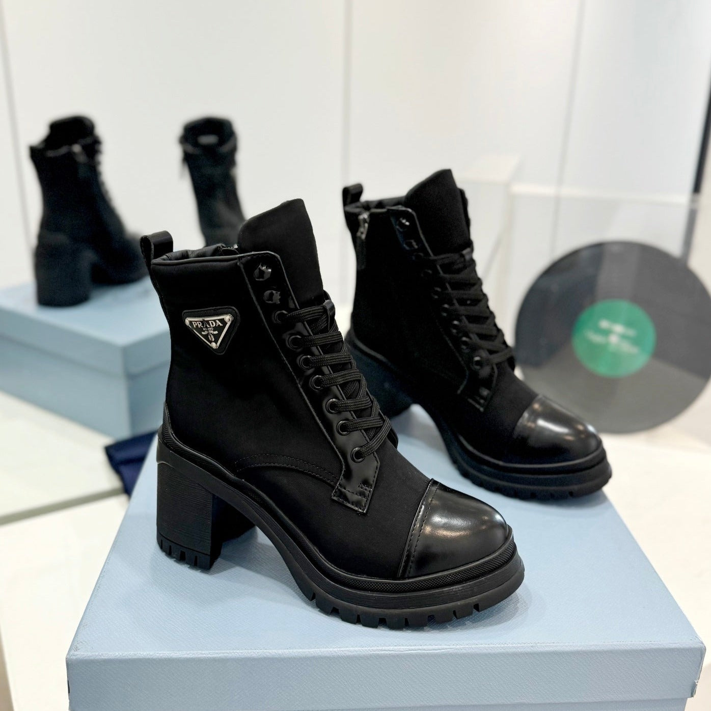 PRADA BRUSHED LEATHER AND RE-NYLON LACED BOOTIES BLACK