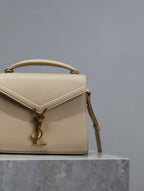 Saint Laurent CASSANDRA MINI TOP HANDLE BAG 20 IN BEIGE CALFSKIN GOLD HARDWARE