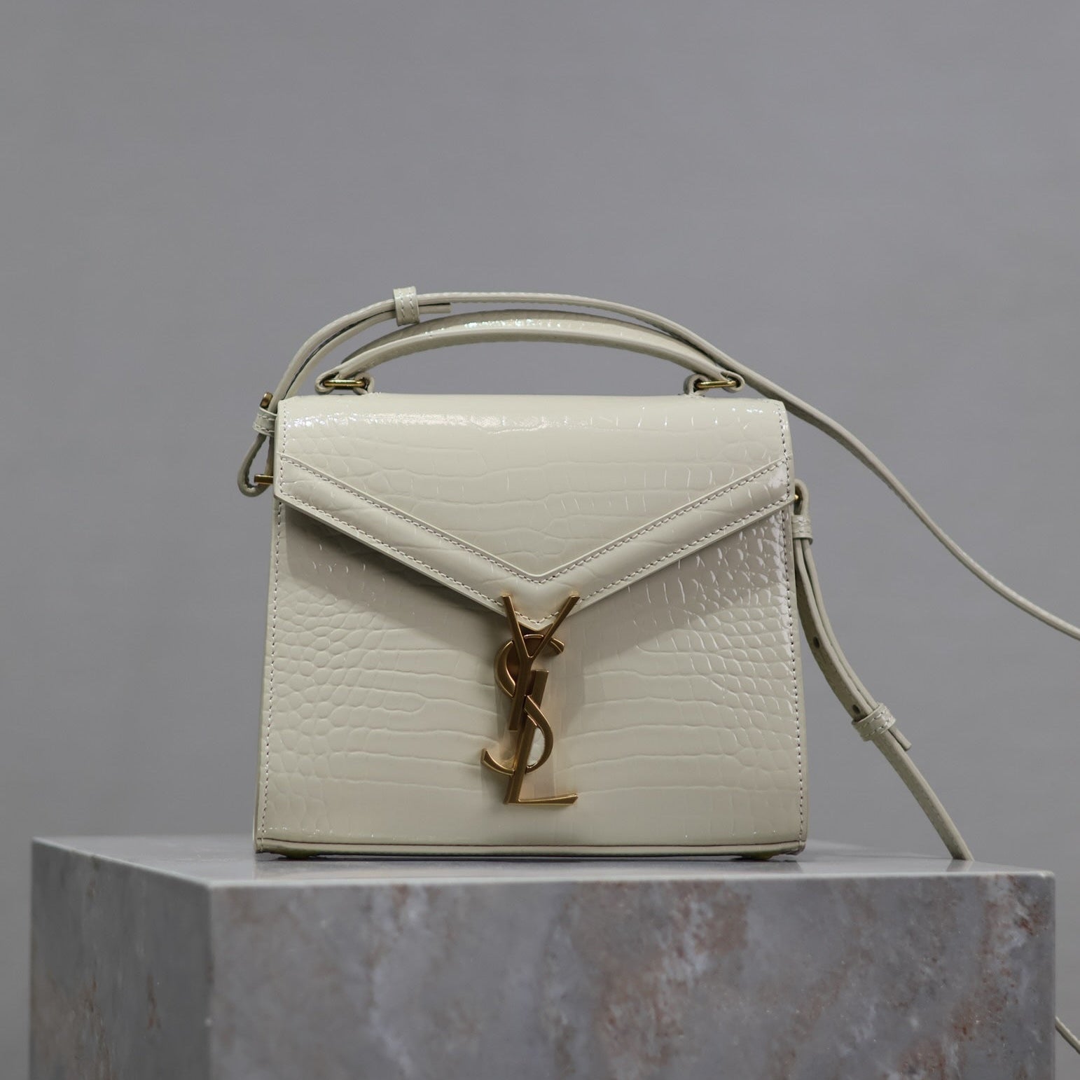 Saint Laurent CASSANDRA MINI TOP HANDLE BAG 20 IN WHITE CROCODILE-EMBOSSED GLOSSY CALFSKIN