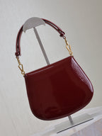 Saint Laurent VOLTAIRE SADDLE BAG 21 IN BORDEAUX RED PATENT CALFSKIN